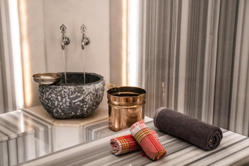 a window sill with a vase and two rolls of thread at Four Points by Sheraton Istanbul Kagithane in Istanbul