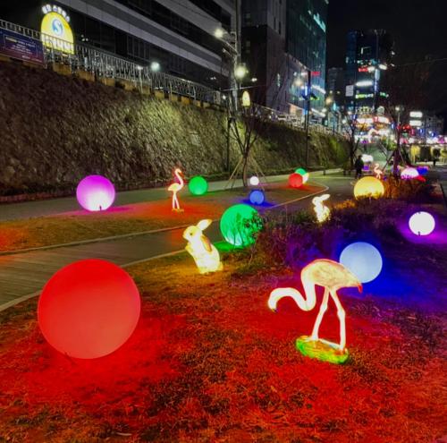 a group of illuminated spheres on a street at night at stayaroma in Seoul