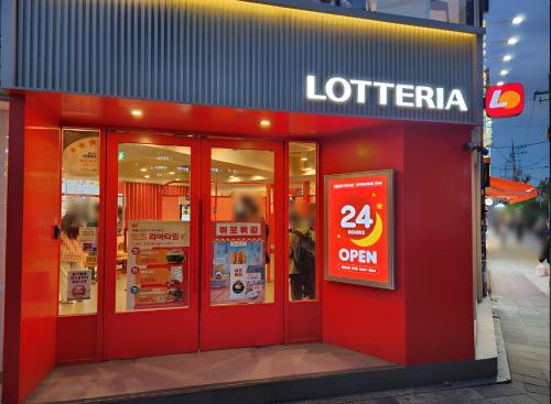 a store with red doors and a sign on it at stayaroma in Seoul