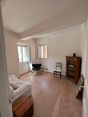 a living room with a couch and a chair at Panorama nel borgo in Monteciccardo