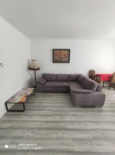 a living room with a couch and a table at Bílý Potok 198 in Weissbach