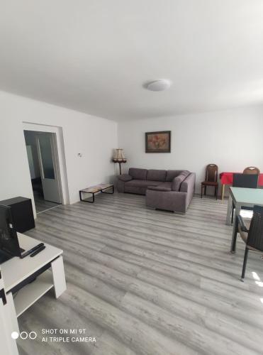 a living room with a couch and a table at Bílý Potok 198 in Weissbach