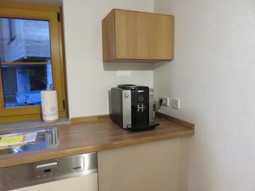 a coffeemaker sitting on top of a kitchen counter at Ferienwohnung Atelier in Bad Bellingen