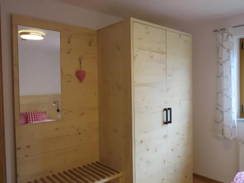 a room with a large wooden cabinet in the corner at Ferienwohnung Atelier in Bad Bellingen