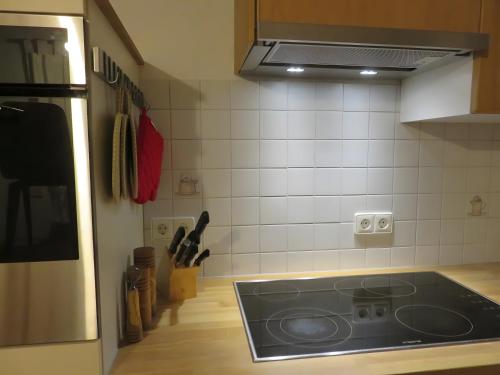 a kitchen with a stove top in a kitchen at Ferienwohnung Atelier in Bad Bellingen