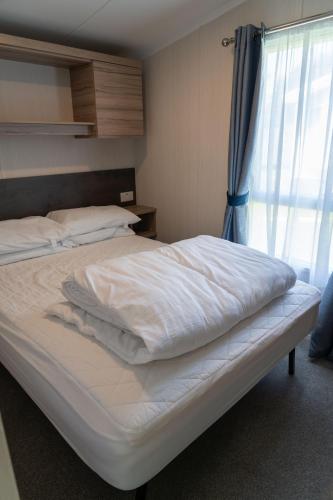 Ένα ή περισσότερα κρεβάτια σε δωμάτιο στο Trevarth Holiday Park