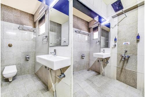 a bathroom with two sinks and a toilet at FabHotel Ranjanas - Nr humkar Chowk in Pune