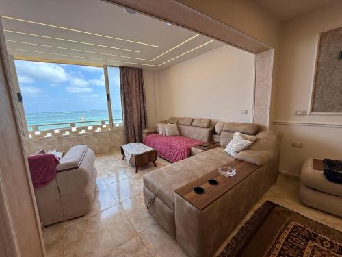 a living room with a view of the ocean at Seaview 3-bedrooms chalet in maamoura beach resort , Alexandria in Alexandria