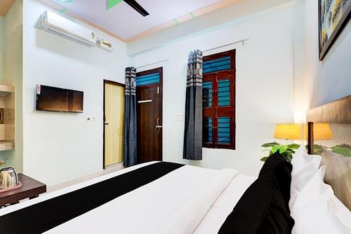 Postel nebo postele na pokoji v ubytování Hotel Royal Residency