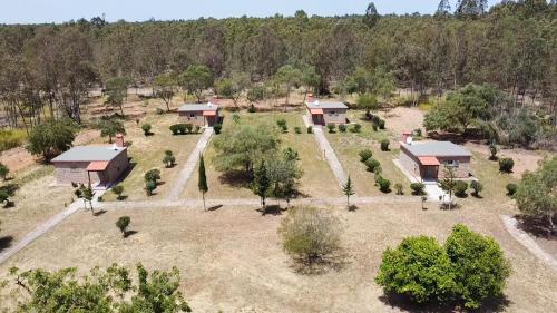 an aerial view of a house with trees and bushes at Hôtel La Cuenda Sochatour in Arbaoua