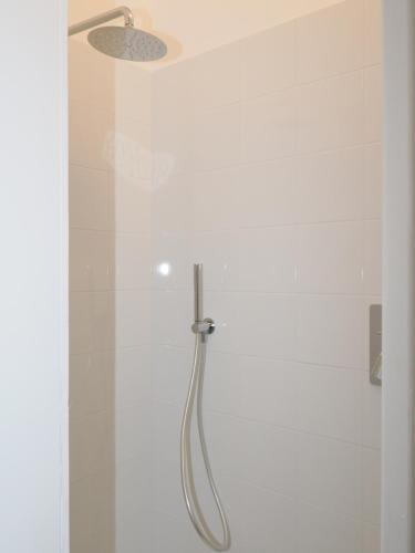 a shower with a shower head in a bathroom at CASA di LU in Civitanova Marche