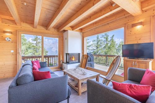 Una televisión o centro de entretenimiento en Ann LANDSCAPED & LUXE chalet 8 pers by Alpvision Résidences