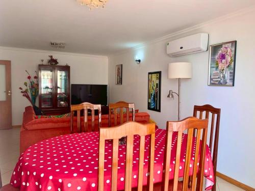 a living room with a table and chairs and a couch at Mar & Morna in Mindelo