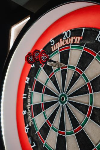 a close up of a dartboard with some darts at The Royal Sutton in Sutton Coldfield