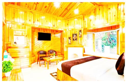 TV a/nebo společenská místnost v ubytování Boost Go Resort Peach-wood Nainital