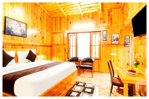 TV a/nebo společenská místnost v ubytování Boost Go Resort Peach-wood Nainital