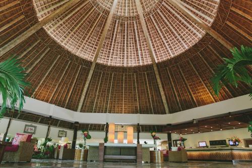a large room with a large straw ceiling at Fiesta Americana Puerto Vallarta All Inclusive & Spa in Puerto Vallarta