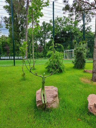 a statue of a deer on a rock in a park at Mayak Resort in Kyiv