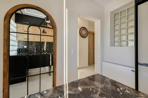 a kitchen with a large mirror and a counter at September15 Suites- Meganisi in Meganisi