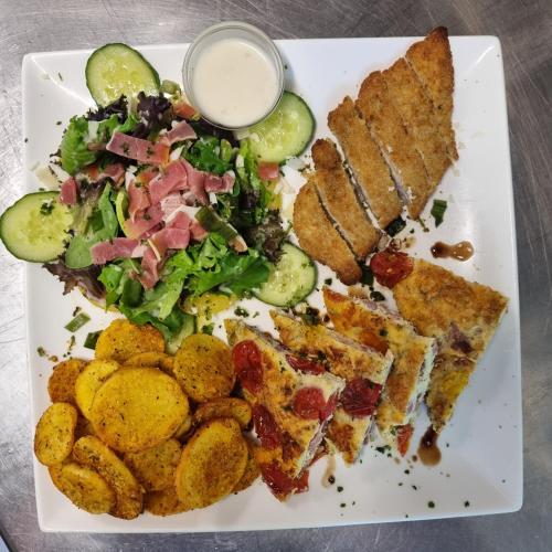 a plate of food with a sandwich and a salad at Chateau de l Aviette - Rancennes in Givet
