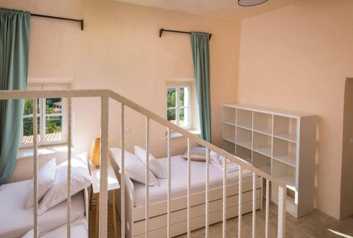 a bedroom with a bunk bed and a staircase at Villa Irma in Pitve
