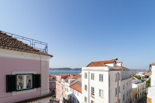 a view of the city from the roofs of buildings at Lapa Diplomatic Suites & Flats by Feel Lisboa in Lisbon