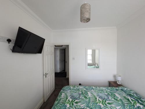 Ένα ή περισσότερα κρεβάτια σε δωμάτιο στο Josh's place near Paignton beach