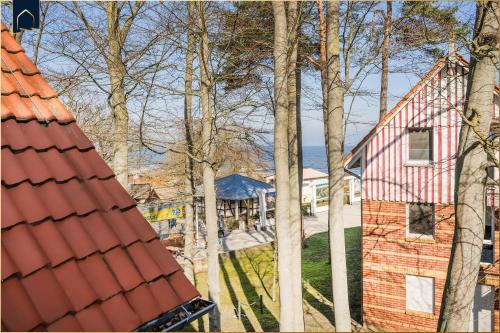 an aerial view of a house and trees at Seeblick Leuchtturm in Ostseebad Koserow