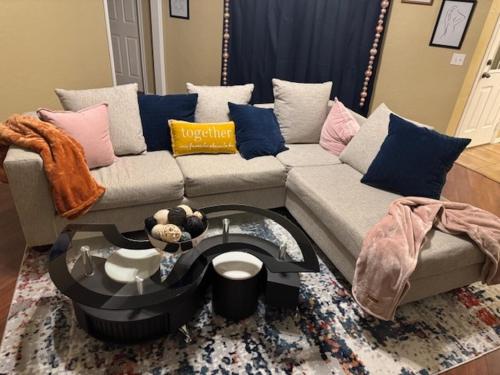 a living room with a couch and a coffee table at Home in Moore Serenity Oasis! relax in style! in Moore