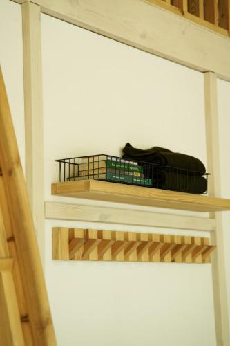 a room with a shelf with a bag on it at Pana Ayusai in Almaty
