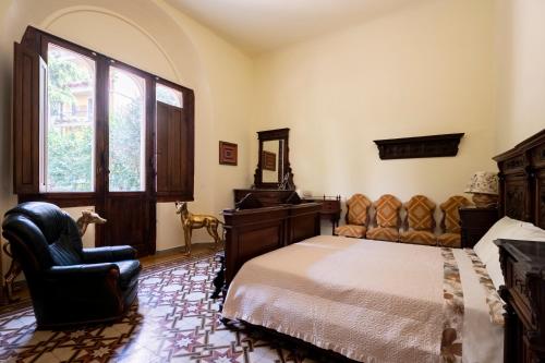 Postel nebo postele na pokoji v ubytování Villa dell'Artista - Camere con bagno privato in Villa storica