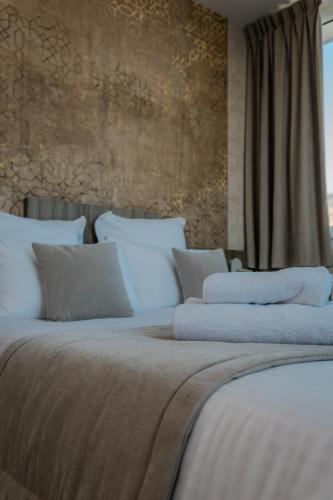 En eller flere senge i et værelse på Le Grand Hôtel de la Marine "face à la mer"