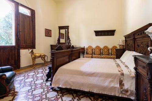Postel nebo postele na pokoji v ubytování Villa dell'Artista - Camere con bagno privato in Villa storica