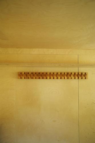 a wooden floor with a brown strip on it at Pana Ayusai in Almaty