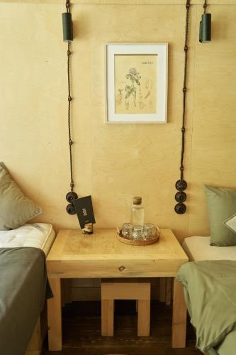 a room with a wooden table in a room at Pana Ayusai in Almaty