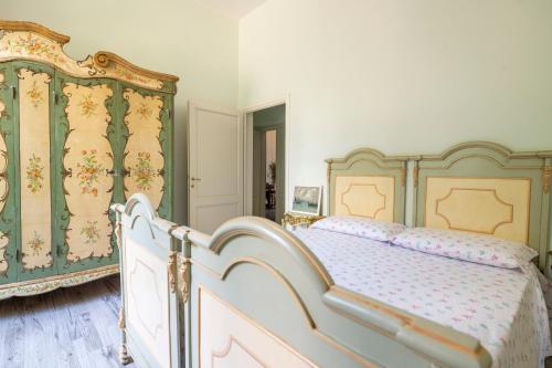 Postel nebo postele na pokoji v ubytování Villa dell'Artista - Camere con bagno privato in Villa storica