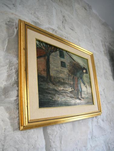 a picture of a painting hanging on a wall at Rooms Malo more Trogir in Trogir
