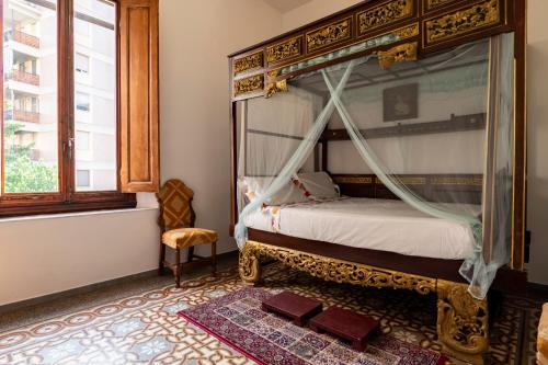 Postel nebo postele na pokoji v ubytování Villa dell'Artista - Camere con bagno privato in Villa storica