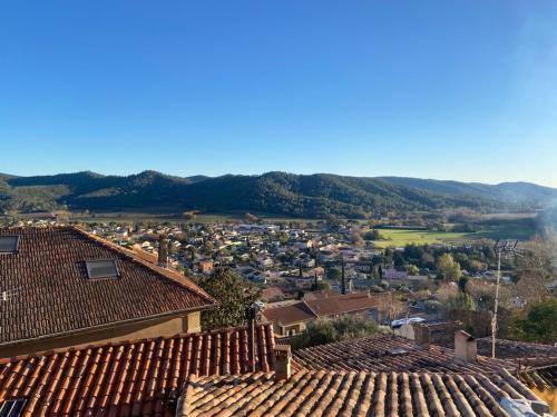 a view of a town with houses and mountains at Village house for 4 people with terrace in Pierrefeu-du-Var