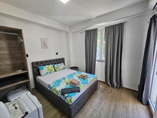 a bedroom with a bed with towels on it at Villa Natali in Ohrid