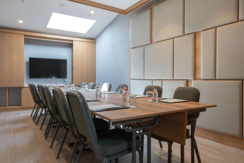 a conference room with a long table and chairs at The Westin Istanbul Nisantasi in Istanbul