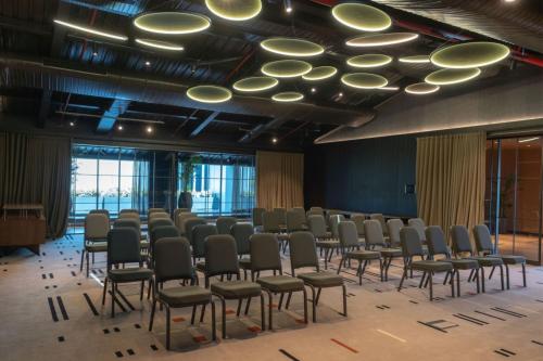 a room with a row of chairs in a room at The Westin Istanbul Nisantasi in Istanbul