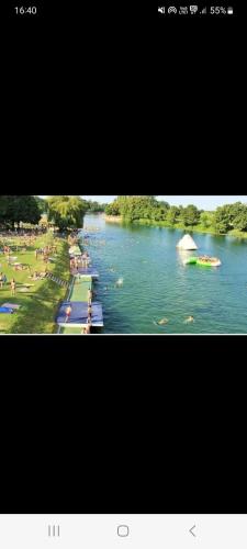 a picture of a river with people on the water at Apartman Star Karlovac in Karlovac