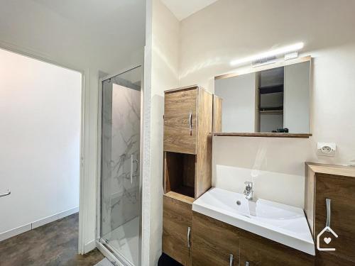 a bathroom with a sink and a shower at La Loggia - Premium apartment 60 m2 in Châtellerault