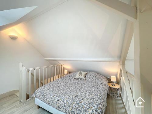 a bedroom with a bed in a attic at La Loggia - Premium apartment 60 m2 in Châtellerault