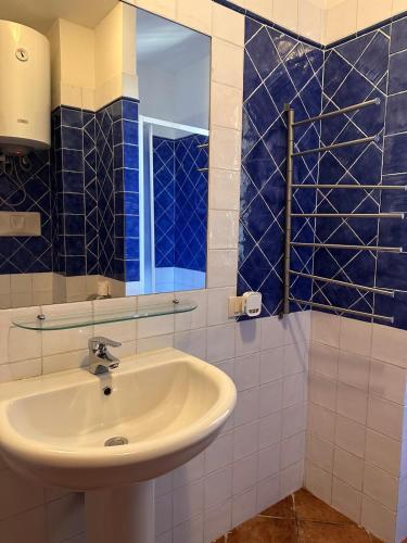 a bathroom with a sink and a mirror at da Bonny in Villasimius