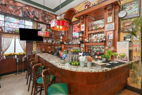 a bar in a restaurant with a large counter at Hotel Chelsea in Miami Beach