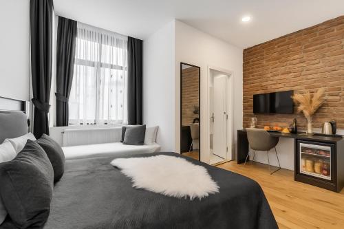 a living room with a couch and a fireplace at The Big Urban Stay in Istanbul