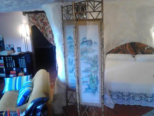 Una cama o camas en una habitación de Casa Sulla Rupe
