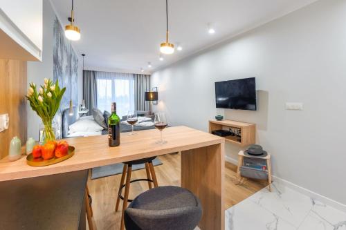 TV a/nebo společenská místnost v ubytování Apartament Perłowe Fale